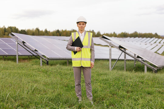 Team leader examining photovoltaic site solar garden 