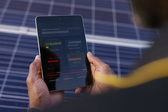 Faceless digital tablet data entering managment solar energy