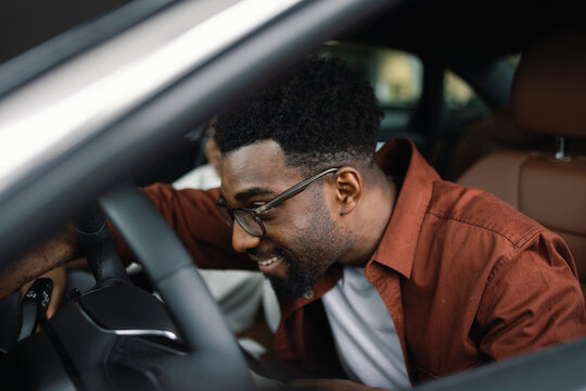Pleased automotive company customer check modern car dealership