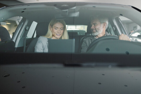 Happy customer test drive vehicle car store automotive industry