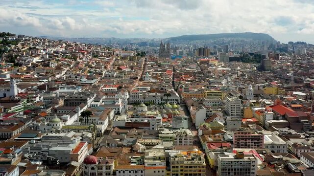 Quito cityscape and architecture in Ecuador on semi-cloudy day on aerial view. 