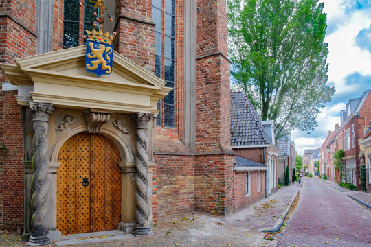 street and entrance of Great or Jacobin  Church from year 1310  in Leeuwarden,  which is capital of Friesland and one of the Eleven Cities of Friesland in The  Netherlands