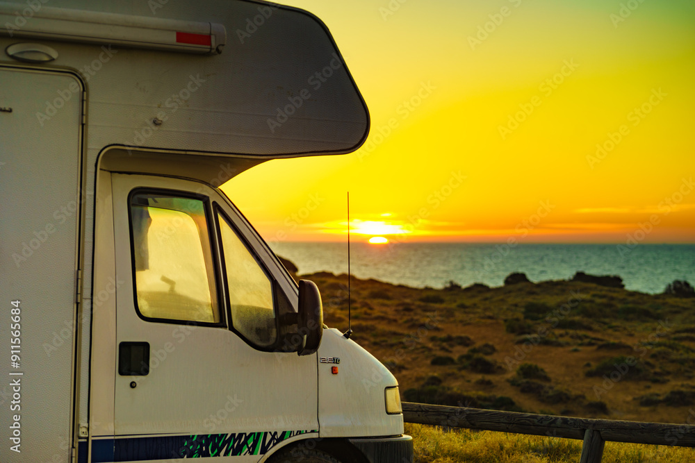 Sticker caravan on beach at sunrise