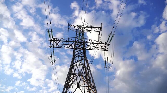Power lines with sun rays on blue sky. High voltage substation. Electricity crisis in the world. Green energy in power lines. Selective soft focus. Zina, Latvia, 10.25.2022
