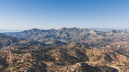 Majestic Rocky Mountain Range Under Clear Blue Sky During Daytime Exploration