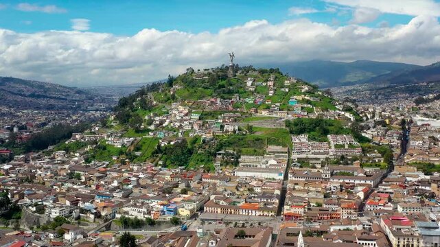 Wide aerial view of hill of El Panecillo and Virgin of the Panecillo sculpture.