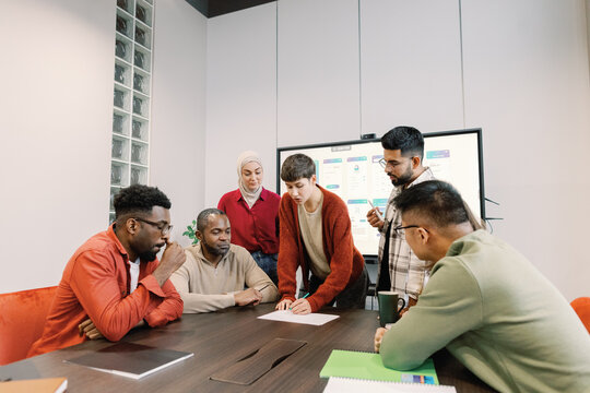  Collaborative group analyzing project details brainstorming session