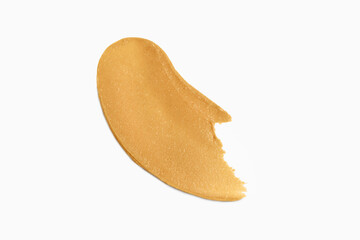 Texture of peanut paste smears on white isolated background. Concept of natural nut products