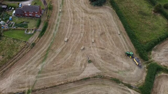 Aerial video of a tractor in the fields of Newport Berkeley in the UK