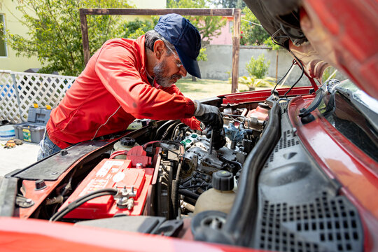 An expert mechanic performs maintenance on your vehicle's engine