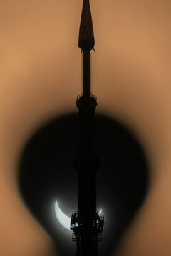 Solar Eclipse Behind Tower
