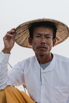 Close-Up of Traditional Fisherman with Straw Hat