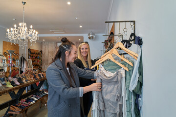 LGBTQ couple shopping together in small independent store