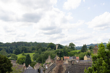 Photo of the beautiful town of Richmond which is a market town and civil parish in North Yorkshire, England showing the historic old houses in the summer time