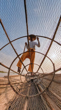 Fisherman Through Net on Inle Lake