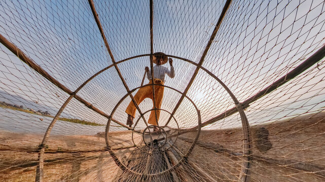 Fisherman Through Net on Inle Lake