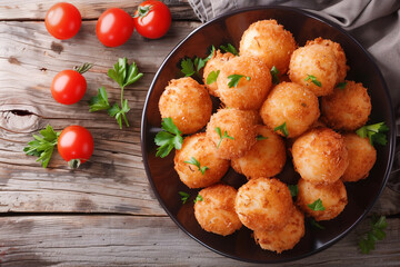 Fototapeta premium cheese croquettes on table, top view