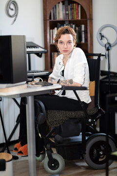 Portrait of a Businesswoman Working from Home Office in Wheelchair