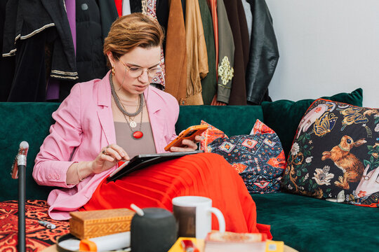 Business Woman Managing Dropshipping Business in Living Room