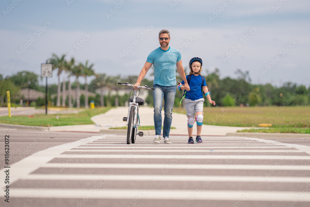 Poster Safety on road. Pedestrian crossing for cyclists. Child in safety helmet with father riding bike in summer day. Fatherhood. Support parent. Fathers day. Child care. Fathers day. Insurance child.