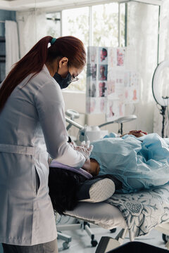 Cosmetologist performing a beauty treatment.