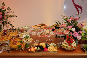 table setting , buffet food in a restaurant, food, table setting at a wedding reception, table setting at a restaurant, table setting, table with food
