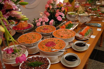table with food, table setting, food, seafood buffet, salmon carpaccio, buffet, restaurant, thai food in a restaurant, table with snacks, varied dishes with salmon
