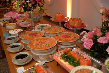 table with food, table setting, food, seafood buffet, salmon carpaccio, buffet, restaurant, thai food in a restaurant, table with snacks, varied dishes with salmon
