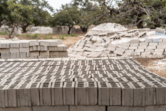 Rows of bricks drying in the sun in a factory in senegal, africa