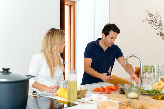 Couple Cooking Together in Kitchen