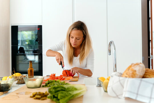 Woman Preparing aperitifs  in Kitchen

