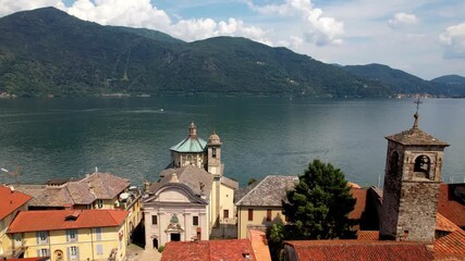 Italy travel. Italian lakes - beautiful Lago Maggiore and scenic village Cannobio in border with Switzerland. Aerial drone 4k hd video