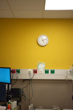 Wall clock in clinical setting, hospital room