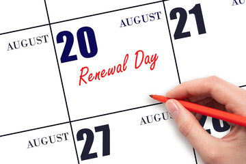 August 20. Hand writing text Renewal Day on calendar date. Save the date.