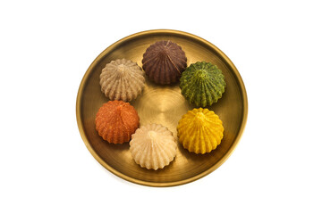 Ganesh Chaturthi Festival. Colorful Modaks Indian sweet dumpling on Plate