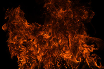 Texture of fire on a black background. Abstract fire flame background, large burning fire.