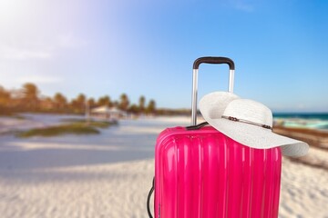 Summer vacation. Suitcase at Tropical Beach