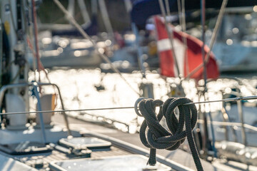 yacht in the harbor with danish flag waving on a blue sky