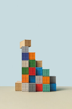 Rectangular box standing perpendicular on stacked containers