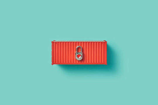 Metal lock laying on red cargo container with ribbed surface