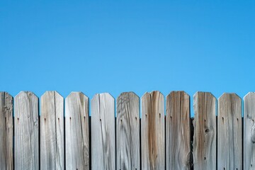 wooden fence and blue sky
