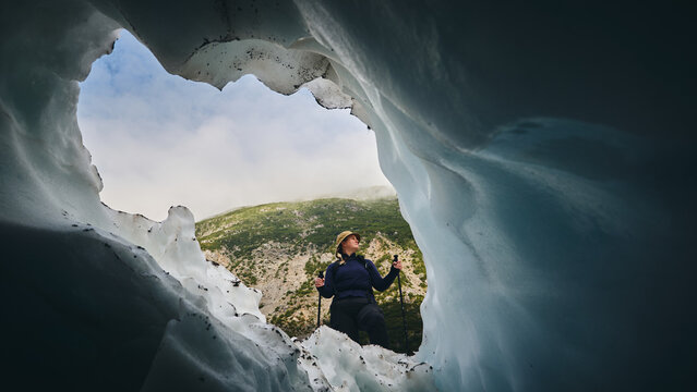 Adventurer hiker in glacier 