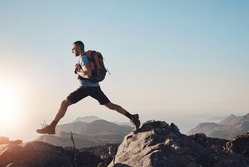 Hiking, man and jump on mountain for fitness, wellness and energy at sky mockup. Trekking, male...