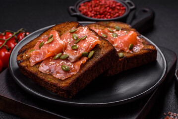 Sandwich or bruschetta with toast, salmon, cream cheese