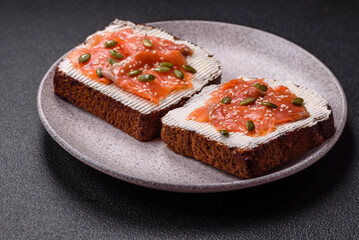 Sandwich or bruschetta with toast, salmon, cream cheese