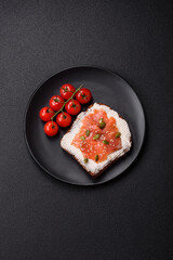 Sandwich or bruschetta with toast, salmon, cream cheese