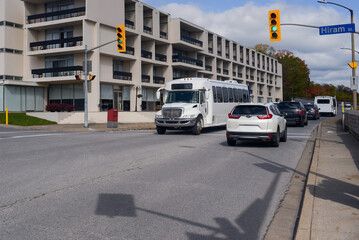 Travel minibus at a green light crossroad