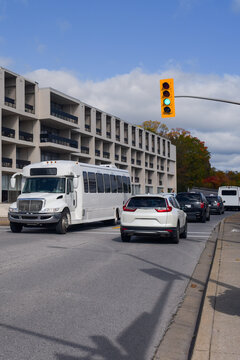 Travel minibus at a green light crossroad