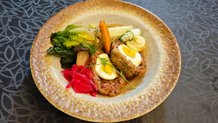 Delicious Wagyu Selat Solo Dish with Colorful Vegetables and Egg on Elegant Plate in Restaurant Setting