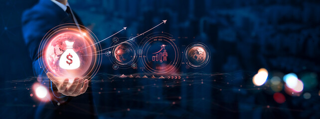 Investment: Businessman hand holding globe with network connecting data of digital technology,...